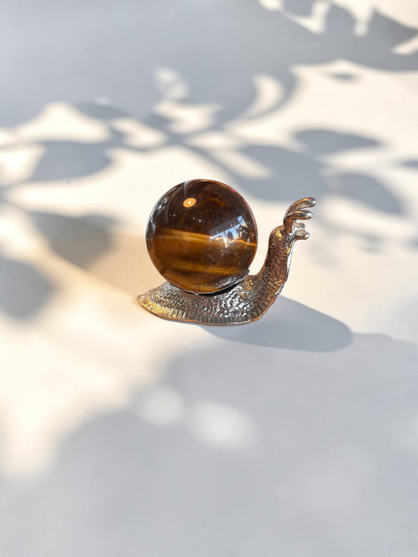 Tigers Eye Crystal Sphere with snail stand